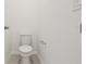 Clean white toilet on neutral tile flooring at 28078 Poppy Ct, Leesburg, FL 34748