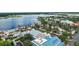 Aerial view of a waterfront town, highlighting its marina, restaurants, and charming architecture at 299 Jefferson Ln, The Villages, FL 32162