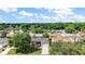 Aerial view of the home showcasing its landscaped yard and neighborhood at 299 Jefferson Ln, The Villages, FL 32162