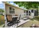 Spacious backyard patio with seating, ideal for outdoor dining and entertaining at 299 Jefferson Ln, The Villages, FL 32162