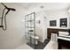 Modern bathroom features sleek glass shower, black hardware and vessel sink at 299 Jefferson Ln, The Villages, FL 32162