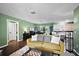 Spacious living room with hardwood floors that connects to the dining area and kitchen at 299 Jefferson Ln, The Villages, FL 32162