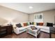 Comfortable living room with plush seating, stylish decor and hardwood floors at 299 Jefferson Ln, The Villages, FL 32162