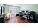 Comfortable office features modern workstation, hardwood floors, plantation shutters and good light at 299 Jefferson Ln, The Villages, FL 32162