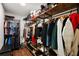 Spacious walk-in closet with custom shelving and ample storage for clothes, shoes, and accessories at 299 Jefferson Ln, The Villages, FL 32162