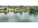 Waterfront homes with private docks and boat lifts, set against a backdrop of serene waters at 3011 Lake Woodward Dr, Eustis, FL 32726