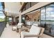 Spacious balcony with seating overlooking a lake, offering indoor-outdoor living and scenic views at 3011 Lake Woodward Dr, Eustis, FL 32726