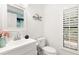 Bright bathroom with contemporary design features, a modern vanity, and stylish fixtures at 3011 Lake Woodward Dr, Eustis, FL 32726