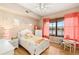 Bright bedroom with window and hardwood floors, nicely decorated, and furnished at 3011 Lake Woodward Dr, Eustis, FL 32726