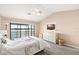 A serene bedroom with lake view, ceiling fan, and a cozy ambiance for relaxation at 3011 Lake Woodward Dr, Eustis, FL 32726
