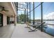 Enjoy the outdoors from your screened-in lanai with a hammock, hanging chair, outdoor kitchen, and waterfront views at 3011 Lake Woodward Dr, Eustis, FL 32726