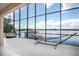 Enjoy Florida sunsets from this screened-in lanai featuring a hammock, hanging chair, and peaceful waterfront views at 3011 Lake Woodward Dr, Eustis, FL 32726