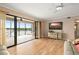 Spacious living room with access to a screened lanai offering beautiful lake views at 3011 Lake Woodward Dr, Eustis, FL 32726
