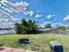 This backyard features a spacious lawn, partial fencing, and room for outdoor activities at 3051 Newmark Dr, Deltona, FL 32738
