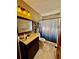 Updated bathroom featuring vanity, mirror, and shower at 3051 Newmark Dr, Deltona, FL 32738