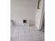 Unfinished bathroom features tiled floor and walls at 3051 Newmark Dr, Deltona, FL 32738