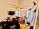 Bedroom with ceiling fan and TV at 3051 Newmark Dr, Deltona, FL 32738