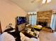 A well-lit living room features a brick fireplace and comfortable seating at 3051 Newmark Dr, Deltona, FL 32738