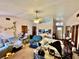 Cozy living room featuring neutral tones, a ceiling fan, and an inviting atmosphere at 3051 Newmark Dr, Deltona, FL 32738