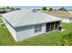 Backyard featuring a screened lanai, providing outdoor living space at 3203 Islawild Way, The Villages, FL 32163
