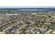 Extensive aerial view of the community, highlighting the homes, lakes, and golf course at 3203 Islawild Way, The Villages, FL 32163