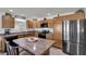 Kitchen boasts stainless steel appliances, modern cabinets, an island and countertops at 3203 Islawild Way, The Villages, FL 32163