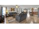 Spacious open-concept living room with modern furnishings and hardwood flooring throughout at 3203 Islawild Way, The Villages, FL 32163