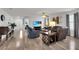 Bright, open living area with modern furnishings and seamless flow into other living spaces at 3203 Islawild Way, The Villages, FL 32163