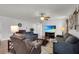 Comfortable living area with a TV, ceiling fan and three sofas perfect for gatherings at 3203 Islawild Way, The Villages, FL 32163