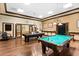 Inviting game room featuring pool tables, stylish decor, and a cozy ambiance for recreational activities at 3654 Limestone St, Clermont, FL 34711
