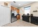Bright kitchen featuring stainless steel appliances, tile floors, and ample cabinet space at 3654 Limestone St, Clermont, FL 34711