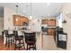 Kitchen with bar seating, stainless appliances, granite countertops, and abundant cabinet space at 3654 Limestone St, Clermont, FL 34711