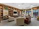 Community library boasts a cozy seating area, large bookshelves, and abundant natural light at 3654 Limestone St, Clermont, FL 34711