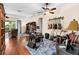 Spacious living room area displaying hardwood floors and a ceiling fan at 3654 Limestone St, Clermont, FL 34711