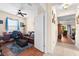 View from a doorway into a home office and beyond into a living room at 3654 Limestone St, Clermont, FL 34711