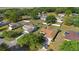 Aerial view showcasing the property's location, landscaping, and neighborhood at 36545 Scottsdale Dr, Grand Island, FL 32735