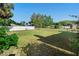 Large backyard featuring grass and privacy fence at 36545 Scottsdale Dr, Grand Island, FL 32735