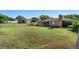 Spacious backyard showcasing a screened-in porch and ample room for outdoor activities at 36545 Scottsdale Dr, Grand Island, FL 32735