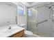 Bathroom featuring shower with glass doors, grab bars and a vanity sink at 36545 Scottsdale Dr, Grand Island, FL 32735
