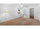 Simple bedroom with wall to wall carpet, a ceiling fan, and ensuite bathroom at 36545 Scottsdale Dr, Grand Island, FL 32735