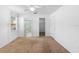 Bright bedroom with carpet, ceiling fan, and ensuite bathroom at 36545 Scottsdale Dr, Grand Island, FL 32735
