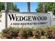 Welcoming Wedgewood community sign displayed among colorful landscaping at 36545 Scottsdale Dr, Grand Island, FL 32735