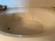Close-up of a clean, white bathtub with jet features at 3708 Fairfield Dr, Clermont, FL 34711