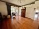 Large bedroom featuring hardwood floors, a ceiling fan, and an armoire at 3708 Fairfield Dr, Clermont, FL 34711