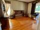 Bedroom with hardwood floors, an antique headboard, and ample natural light at 3708 Fairfield Dr, Clermont, FL 34711