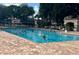 Community swimming pool with lounge chairs and clear blue water at 3708 Fairfield Dr, Clermont, FL 34711