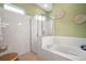 Bathroom showcasing a soaking tub and walk-in shower at 3828 Arbordale Ct, Leesburg, FL 34748
