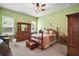 Spacious main bedroom with ceiling fan, carpet, and multiple windows for natural light at 3828 Arbordale Ct, Leesburg, FL 34748
