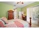 Main bedroom showcasing a large closet, carpet flooring, and a ceiling fan at 3828 Arbordale Ct, Leesburg, FL 34748