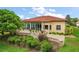 Beautiful backyard showcasing a spacious patio, lush greenery, and elegant landscaping at 38716 Oak Place Ct, Lady Lake, FL 32159